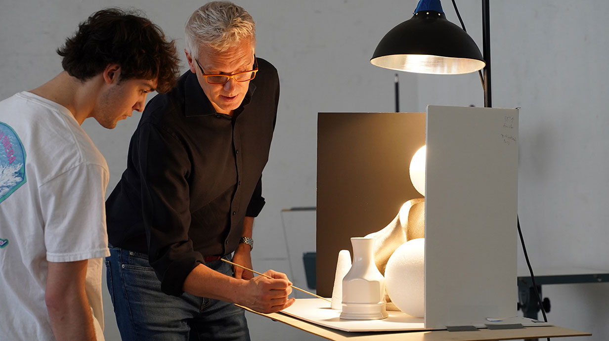Thomas coon showing a student lighting