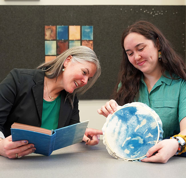 Brooke white and angel Morgan looking at art