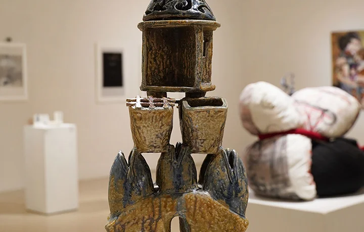 brown ceramic sculpture in gallery setting