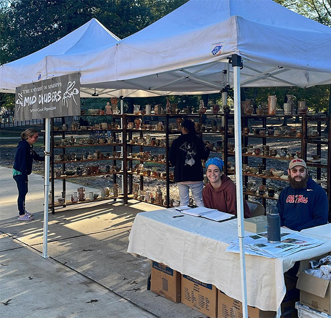 mud daubers club set up outside the grove