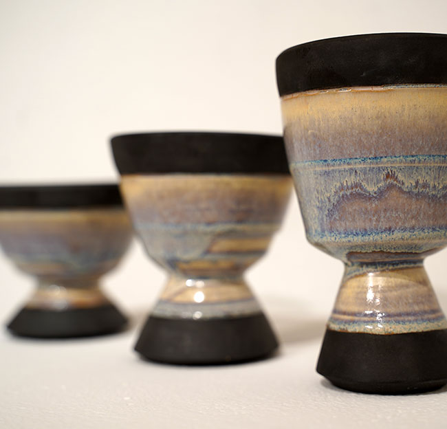 Three ceramic art cups