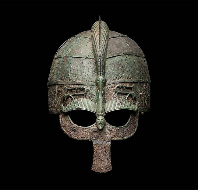 ancient Viking helmet on black background