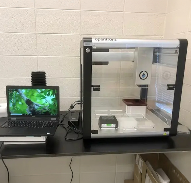 computer and 3d printer on a table