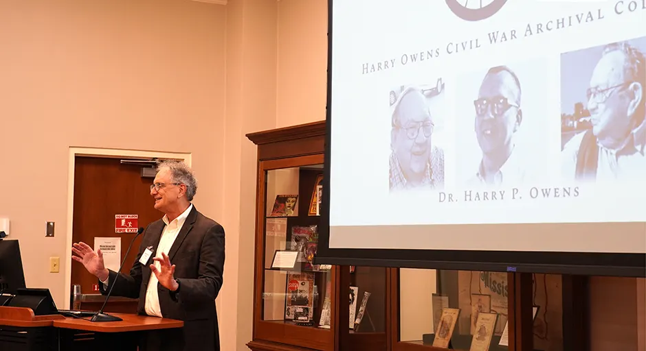 Doug Sullivan-Gonzalez speaks at reception