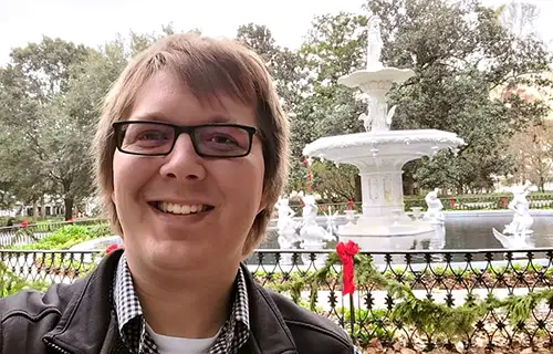 Matthew Lempke with fountain in background