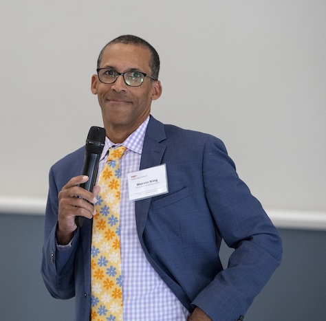 professor talks into microphone