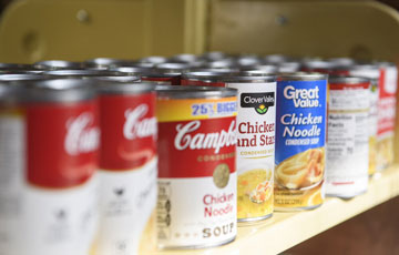 soup cans on a shelf
