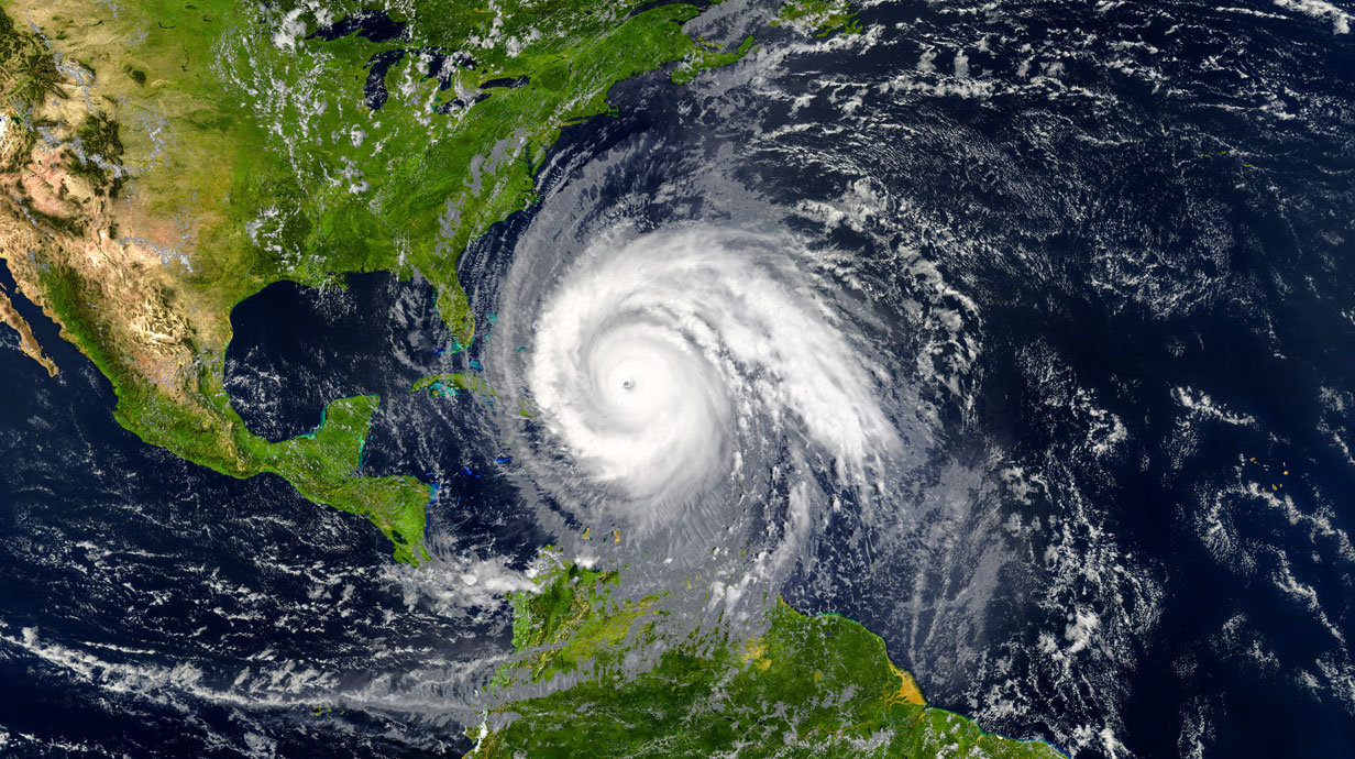 aerial view of US with a hurricane in the waters