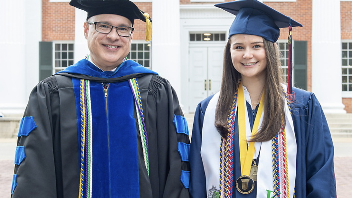 Sydney Pearl Wheeler in graduation robe with university provost