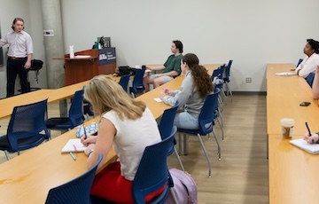 professor henry thompson teaches a class