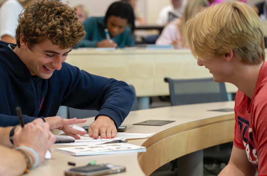two students work together at a