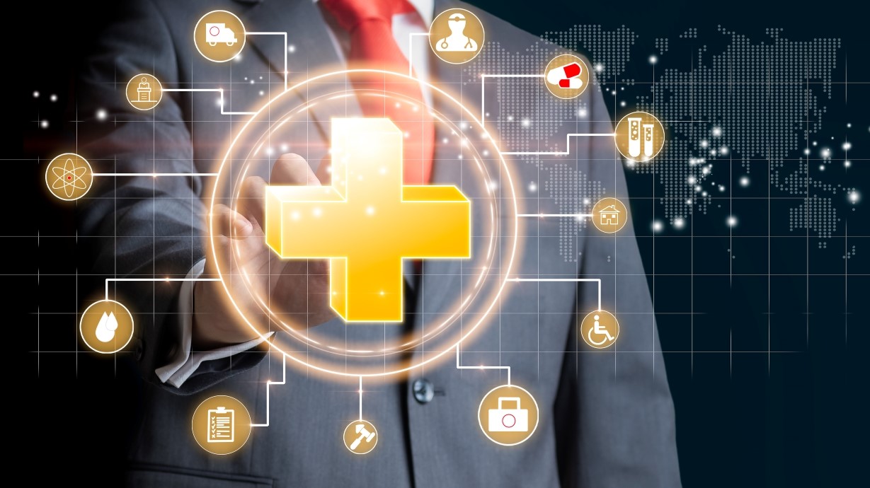 image of a man in a business suit pointing to healthcare symbols