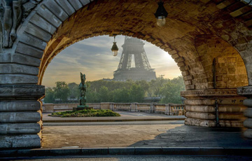 Eiffel tower under an archway