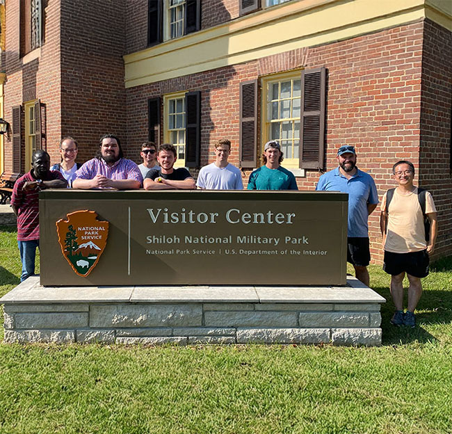 group photo of students standing behind Siloh National Military Park sign