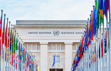 outside of United Nations building with every country's flags on display