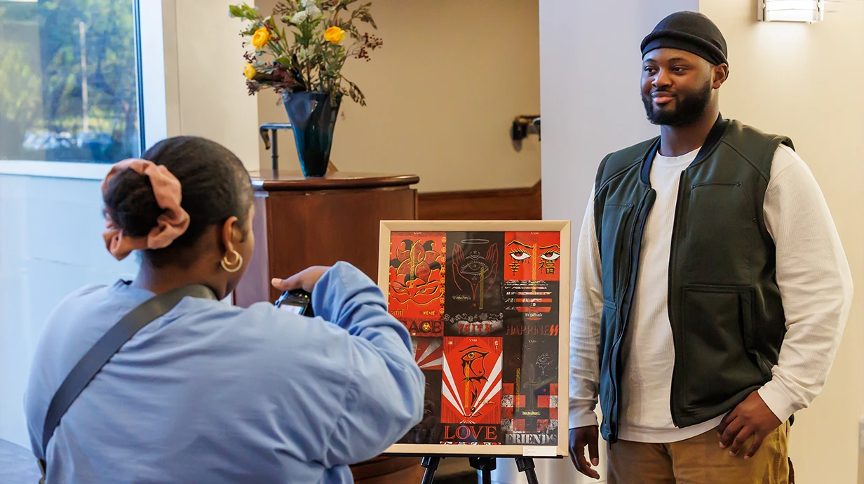 An art student and his work are photographed