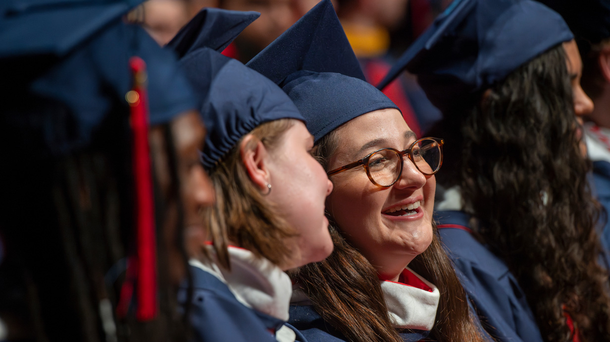 student in graduation regalia