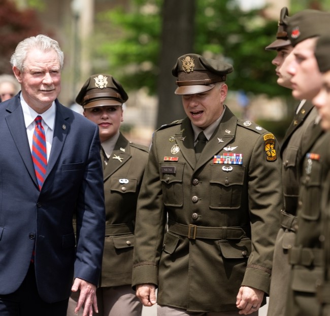 Chancellor and Army Commander walking down the row of army cadets