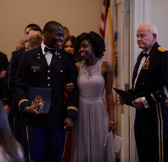 image of cadets and their dates lined up to enter the dining out event