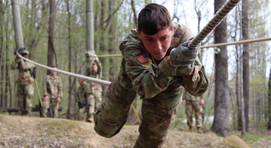 cadet crosses a rope bridge