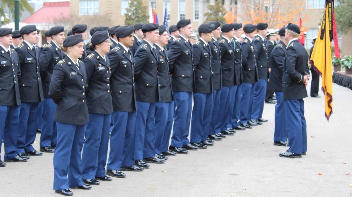 image of cadets lined up in formation in uniforms on campus