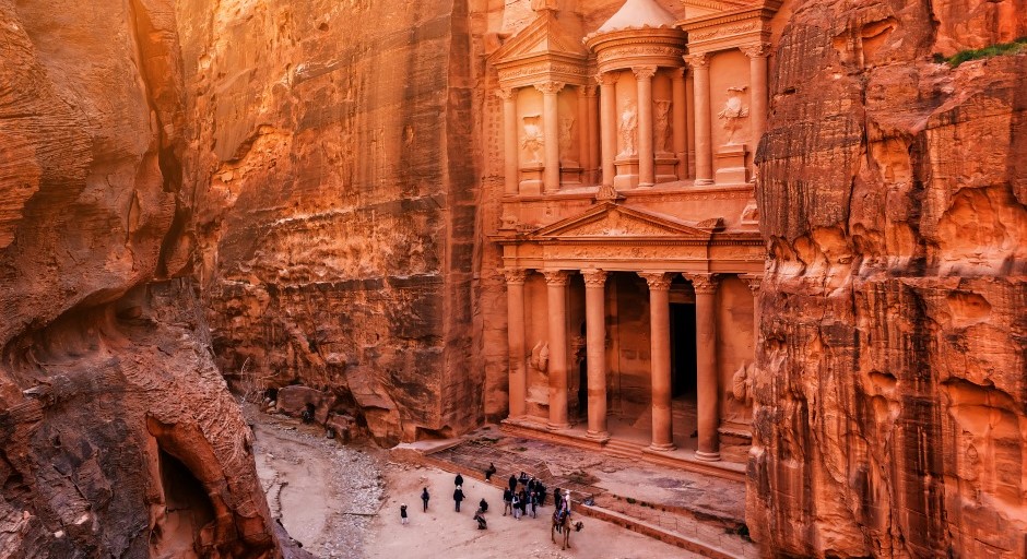 image of Petra site of carved building facade in the side of a desert mountain