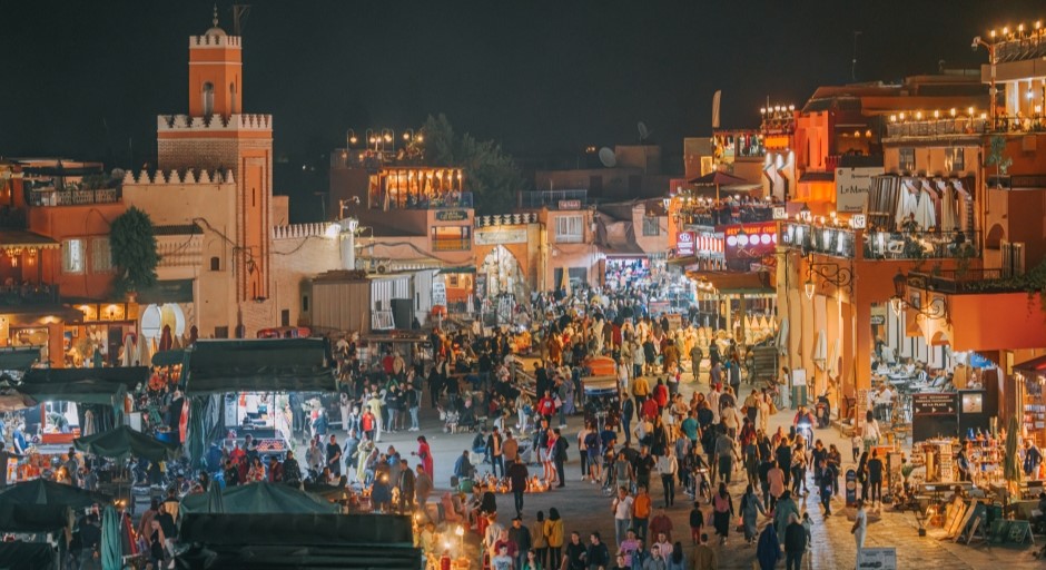 evening market with lots of people gathered in a major square