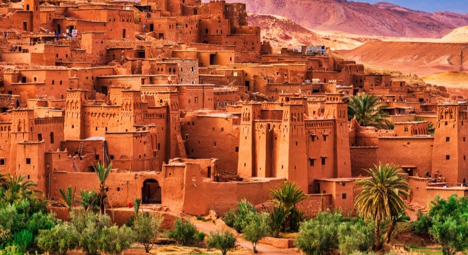 traditional village with adobe houses that line the side of a mountain