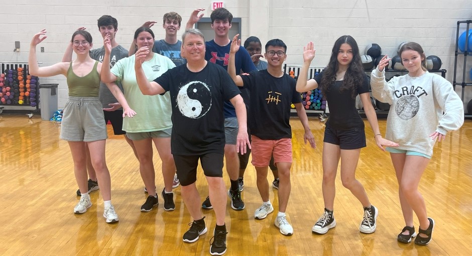 students practicing karate in a gym