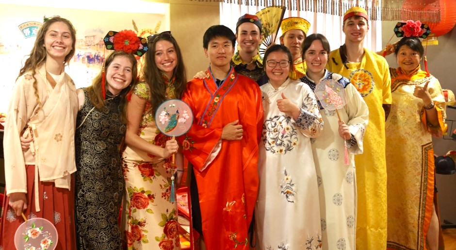 students standing in traditional Chinese clothing