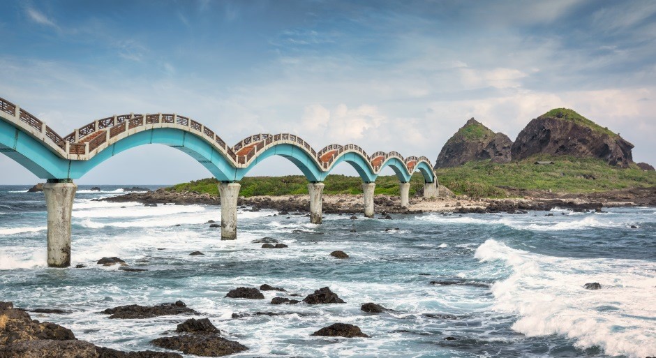 image of a pedestrian bridge with arches to represent a dragon