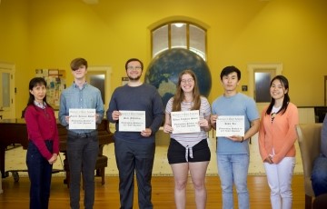 image of a group of students holding certificates