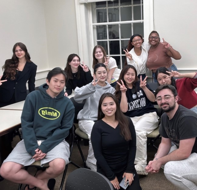 small group of students sitting together having fun in a classroom