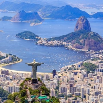 aerial view of Rio de Janerio, Brazil with buildings, sea, and mountains