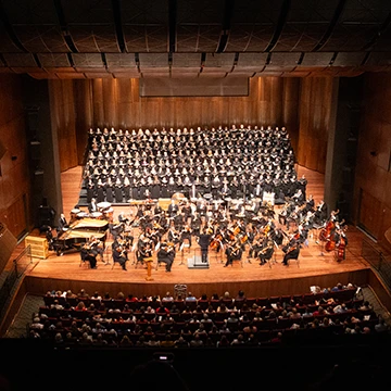 Choir performs on stage in the Ford Center