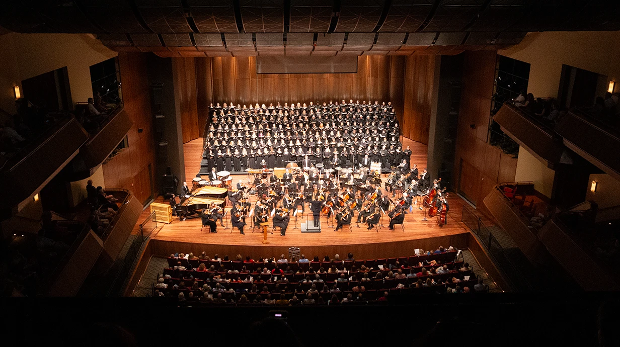 LOU Symphony Orchestra and UM Choirs  performing on stage in the Gertrude C. Ford Center