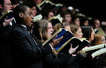 choral singers with songbooks 