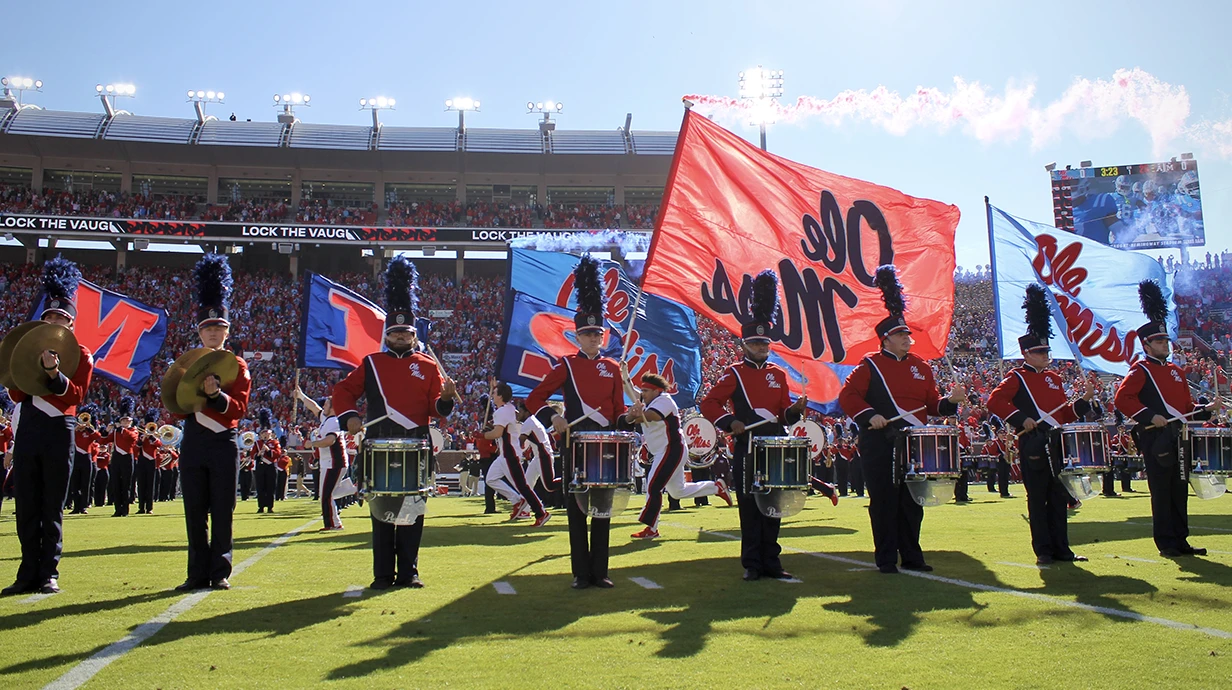 Ole Miss drumline performing on the field 