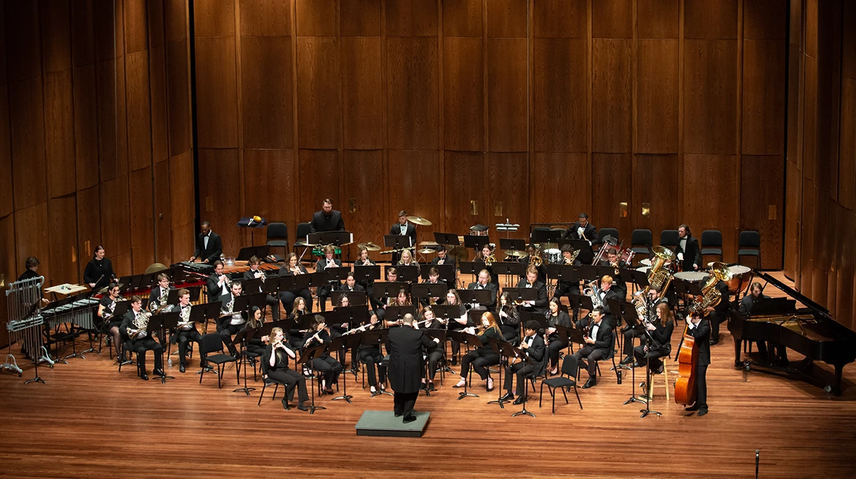 Wind Ensemble performs on stage in the Ford Center