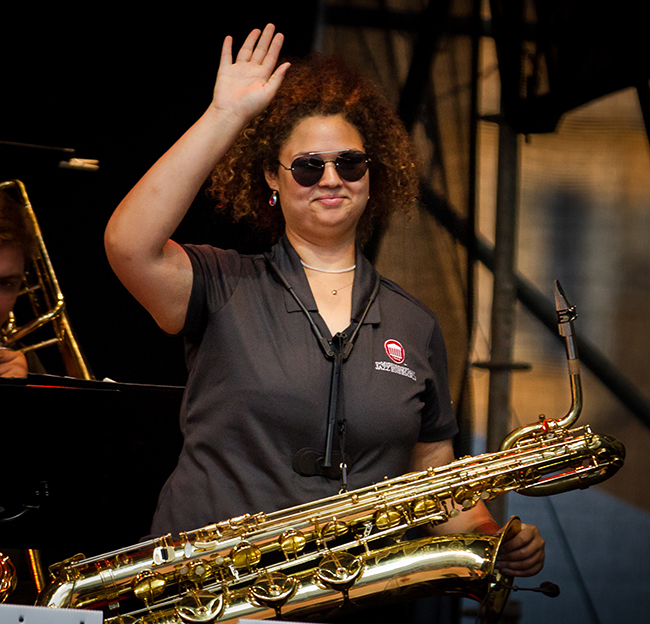 student saxophone player waves at crowd at the Umbria Jazz Festival