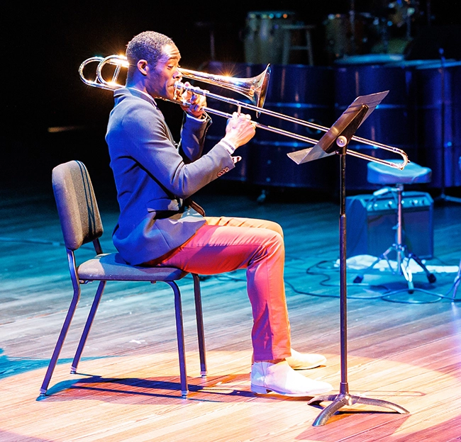 musician on stage playing trombone 