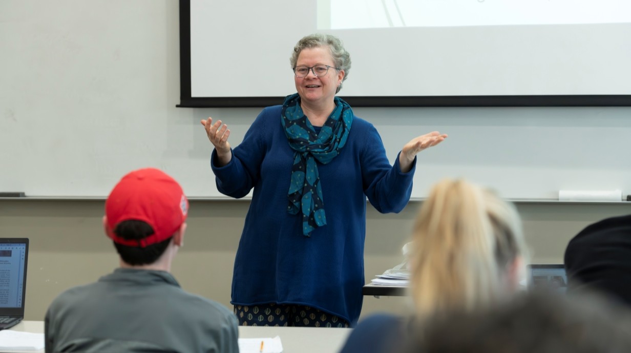 photo of faculty member talking in front of the classroom
