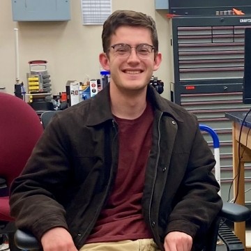 image of student seated in a chair