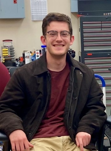 image of Daniel Stewart seated in a lab