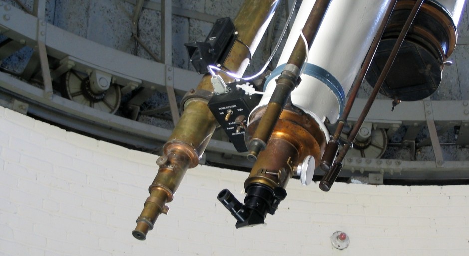 image of three telescope lenses together in observatory dome