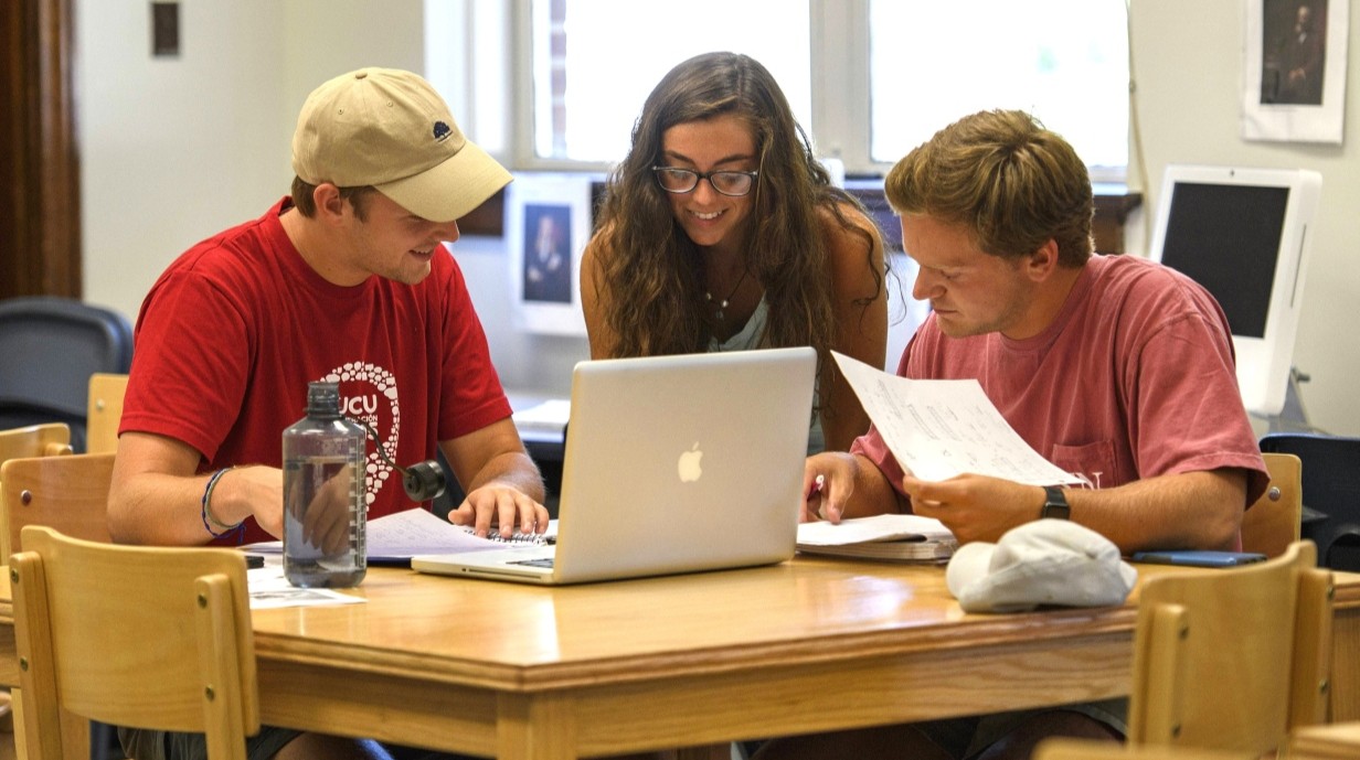 image of three students studying together