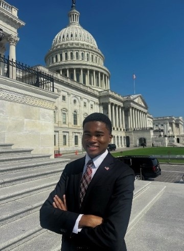 image of Edward Hunter standing in front of US Capitol Building