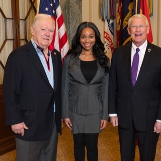 student standing with Governor Barbour and Senator Wicker