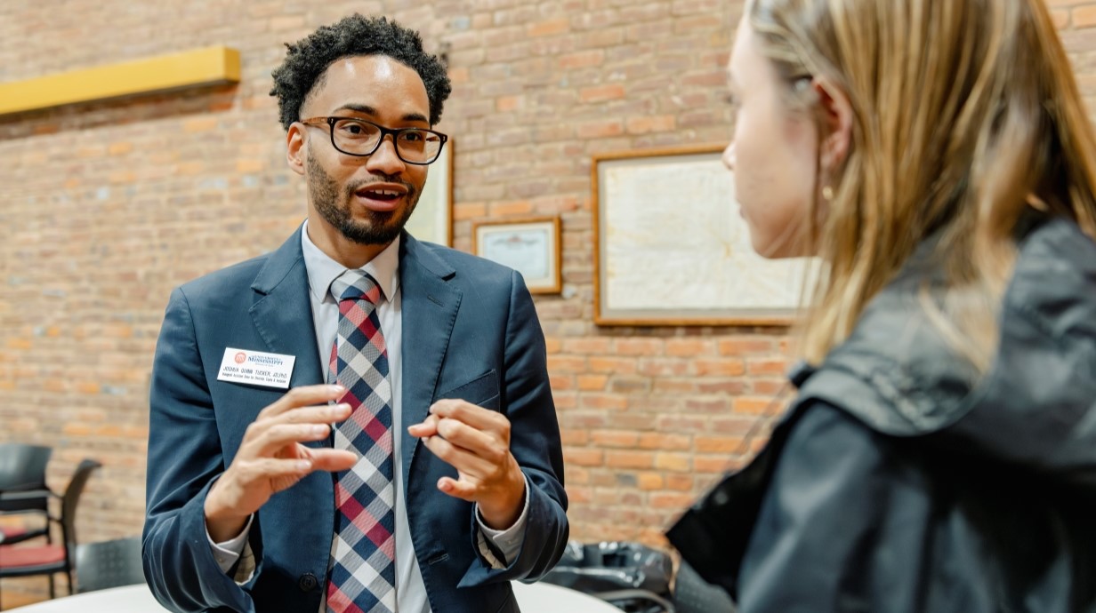 an alum talking with a student