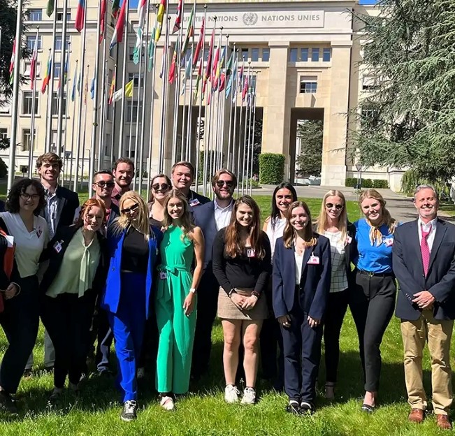 image of a group of students standing in front of the United Nations building in Vienna, Austria